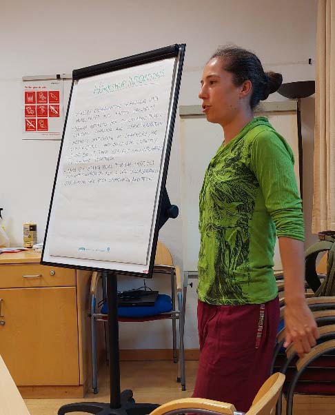 woman standing next to a clipboard