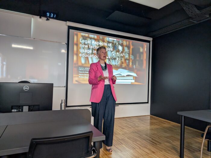 a person standing in front of a presentation
