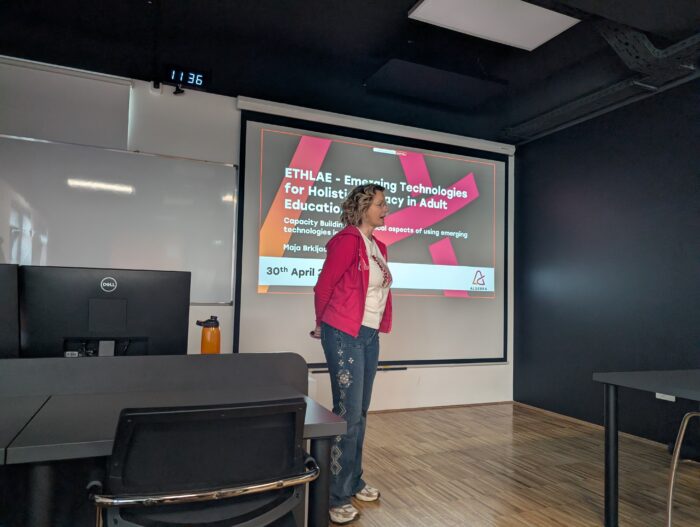 a person standing in front of a presentation